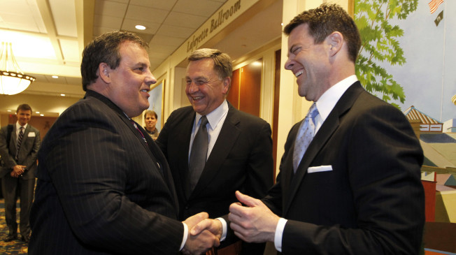 New Jersey Gov. Chris Christie, left, talks to Bill Baroni, right, deputy executive director of the Port Authority of New York and New Jersey, and David Samson, chairman of the Port Authority of New York and New Jersey, during the New Jersey Transportation Conference, Wednesday, March 2, 2011, in Trenton, N.J. (AP Photo/Julio Cortez)