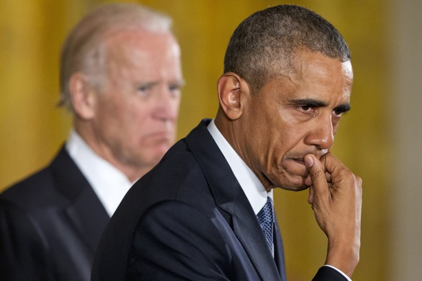 An emotional President Barack Obama, joined by Vice President Joe Biden, pauses as he recalled the 20 first-graders killed in 2012 at Sandy Hook Elementary School, while speaking in the East Room of the White House in Washington, Tuesday, Jan. 5, 2016, about steps his administration is taking to reduce gun violence. (AP Photo/Jacquelyn Martin)